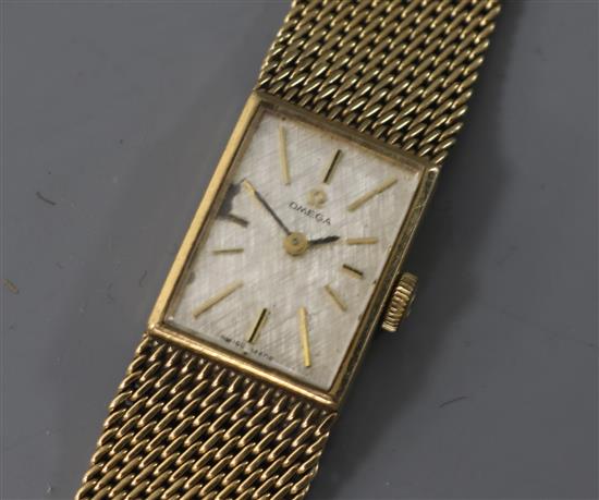 A ladys 9ct gold Omega manual wind wrist watch.